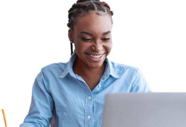 Image of a visibly happy lady working on her laptop and feeling refreshed.