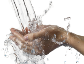 Image of a hand collecting flowing water