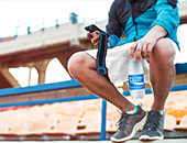 Image of a man holding a bottle of Pocari Sweat