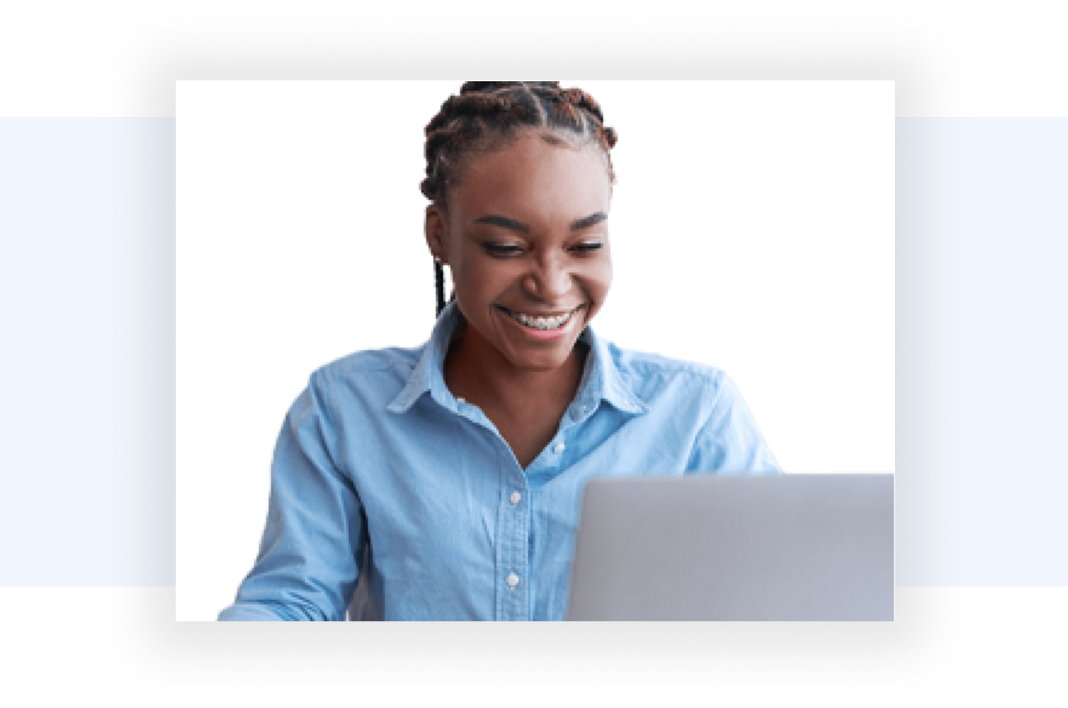 Image of a visibly happy lady working on her laptop and feeling refreshed.