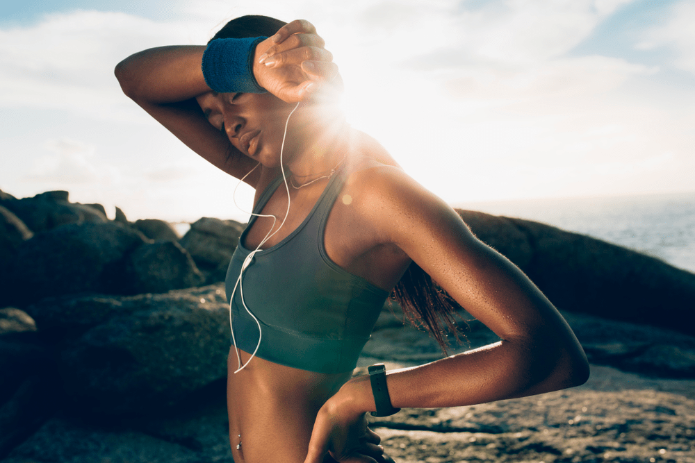 An image of a sweaty lady in need of replenishment after running.